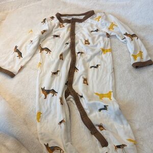 Kyte BABY white romper in adorable dog print in yellow, brown and black